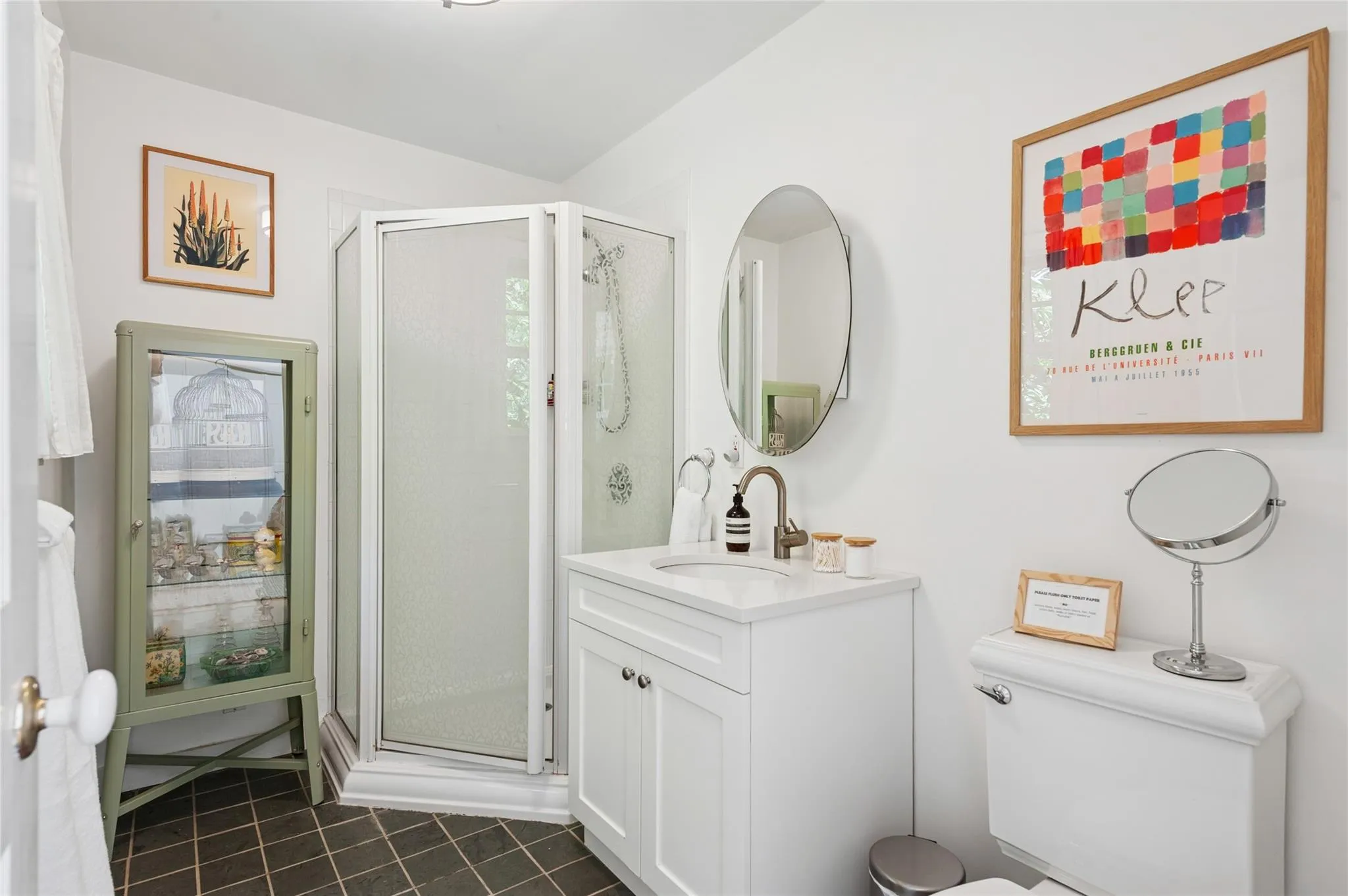 Bathroom with vanity, a shower stall, and tile patterned floors Bathroom with vanity, a shower stall, and tile patterned floors