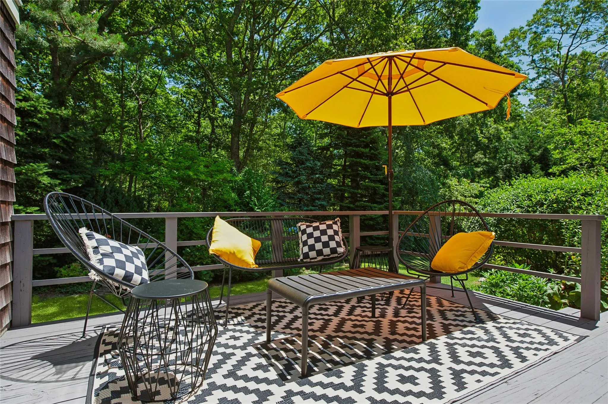 Wooden terrace with view of wooded area Wooden terrace with view of wooded area