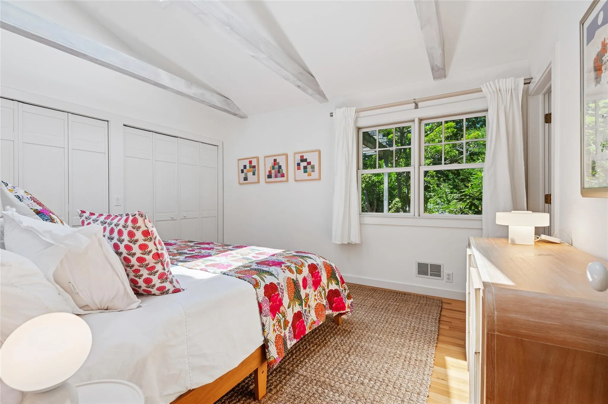 Bedroom with light wood-type flooring and baseboards Bedroom with light wood-type flooring and baseboards