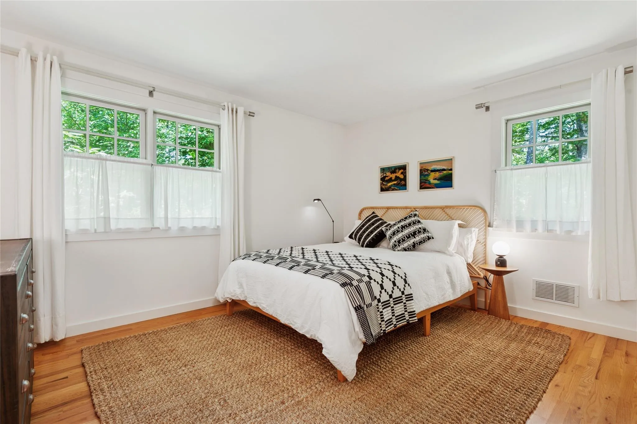 Bedroom featuring wood finished floors Bedroom featuring wood finished floors