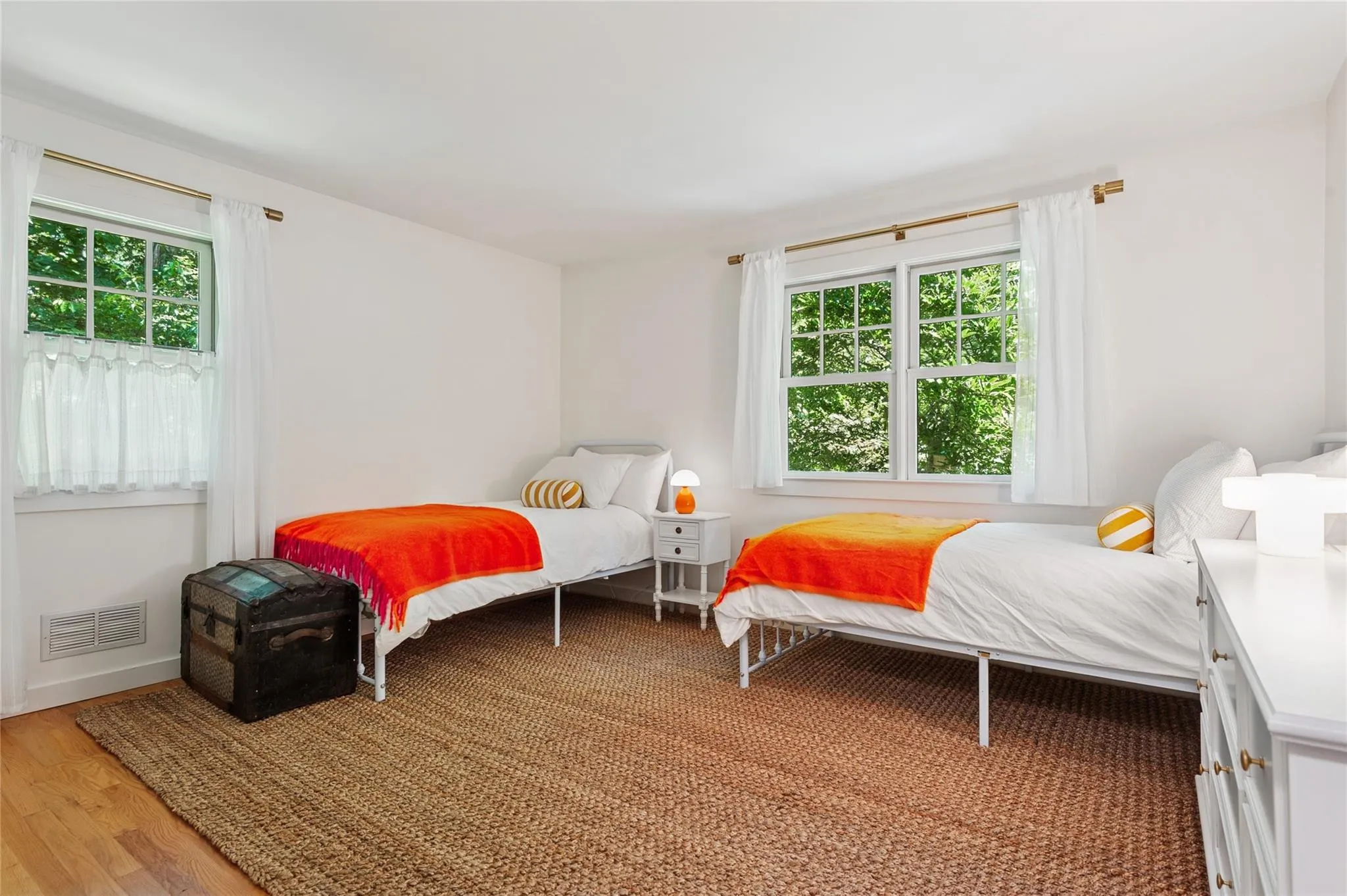 Bedroom featuring light wood-style flooring and baseboards Bedroom featuring light wood-style flooring and baseboards
