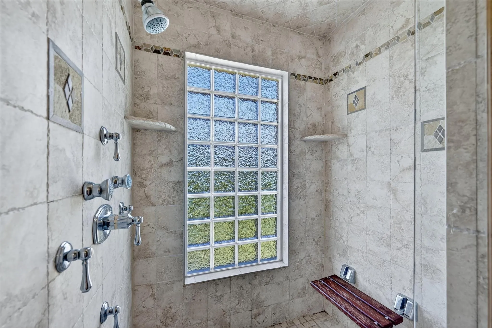 Full bathroom with a tile shower Full bathroom with a tile shower