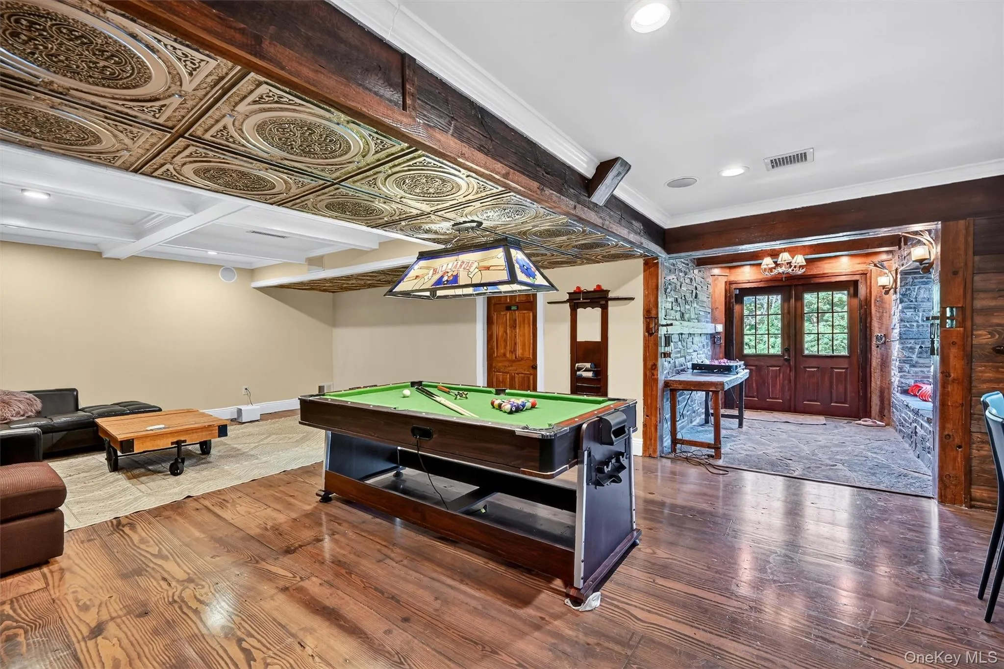 Playroom featuring hardwood / wood-style flooring, billiards table, recessed lighting, ornamental molding, and beamed ceiling Playroom featuring hardwood / wood-style flooring, billiards table, recessed lighting, ornamental molding, and beamed ceiling