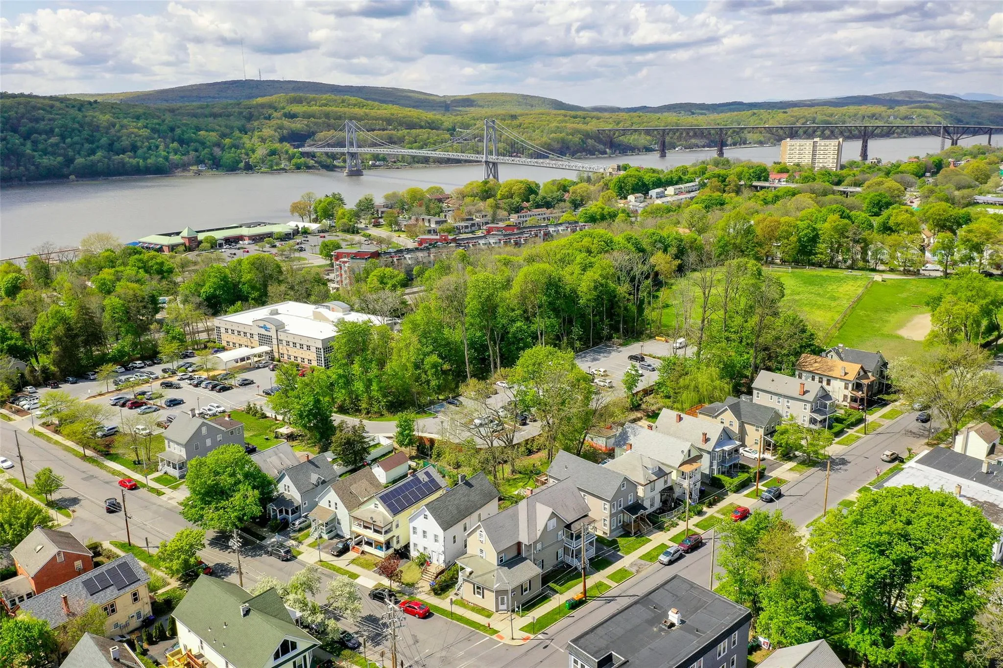 Aerial view of a notable bridge and a large body of water Aerial view of a notable bridge and a large body of water