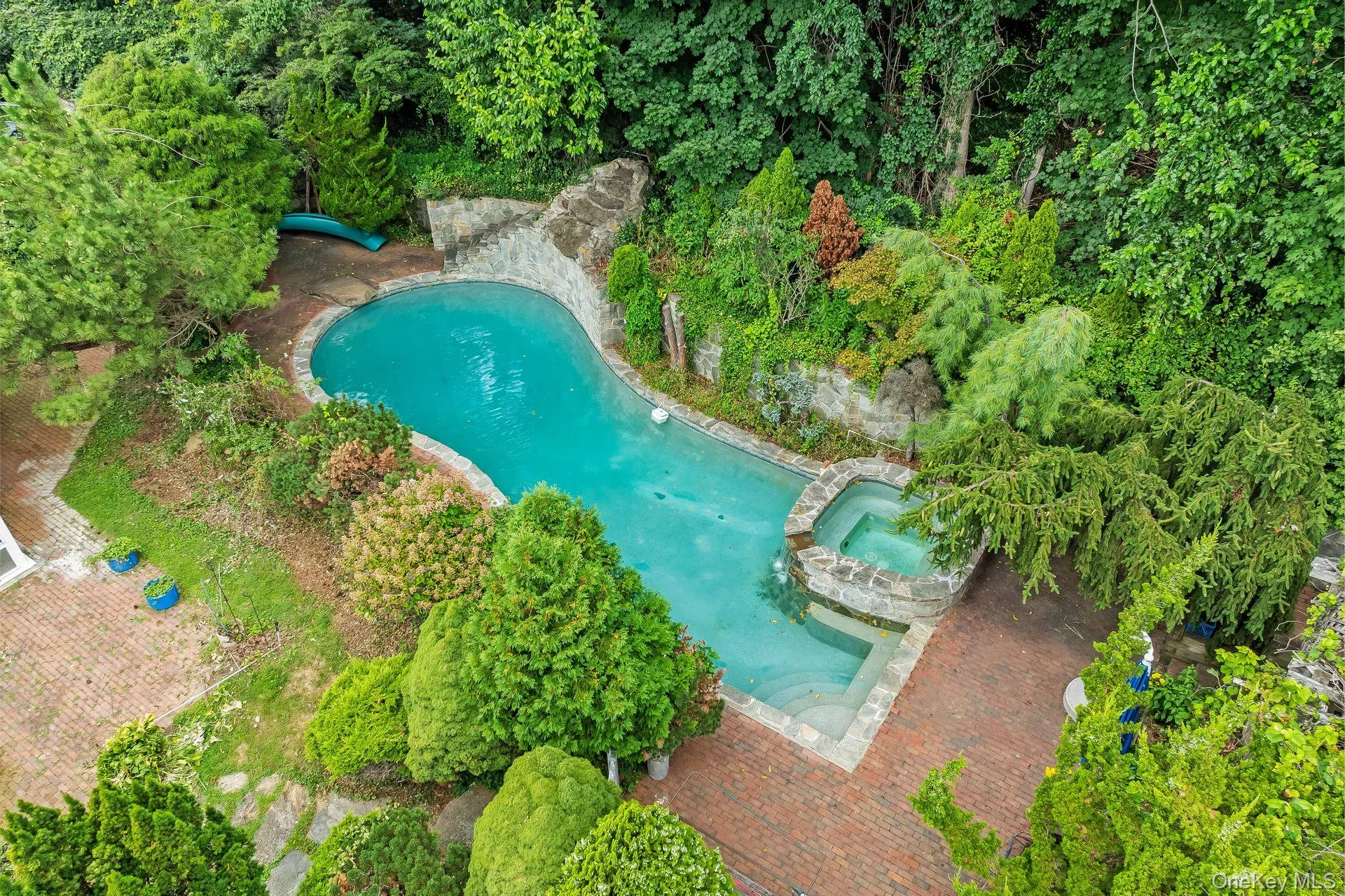 Aerial view of property\'s location with a pool area Aerial view of property\'s location with a pool area
