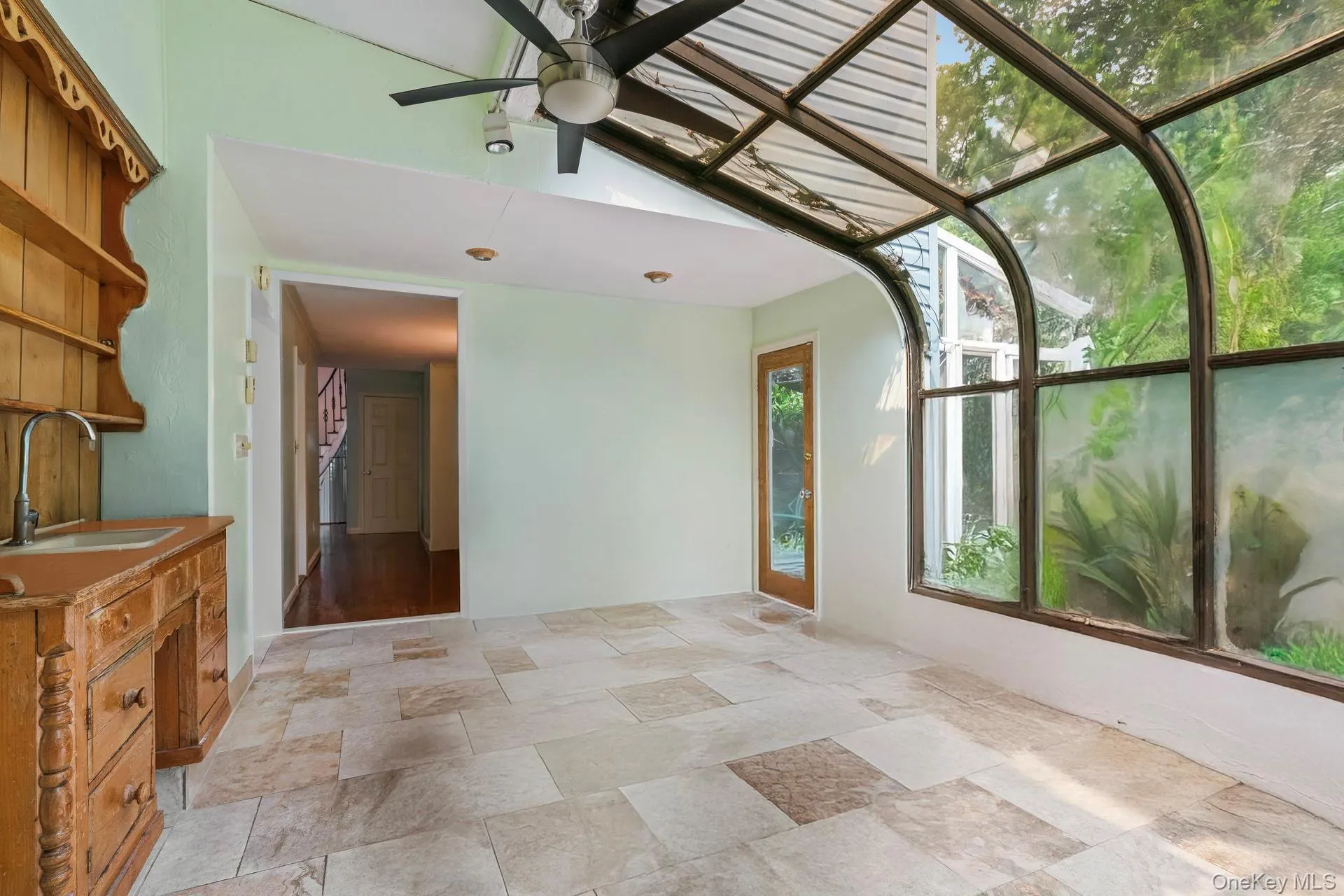 Unfurnished sunroom with a sink Unfurnished sunroom with a sink