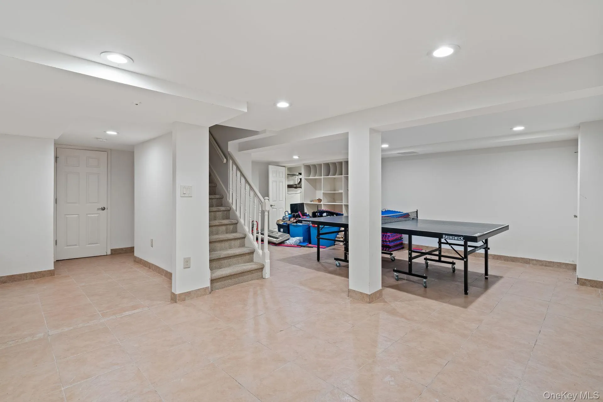 Recreation room featuring recessed lighting and light tile patterned flooring Recreation room featuring recessed lighting and light tile patterned flooring