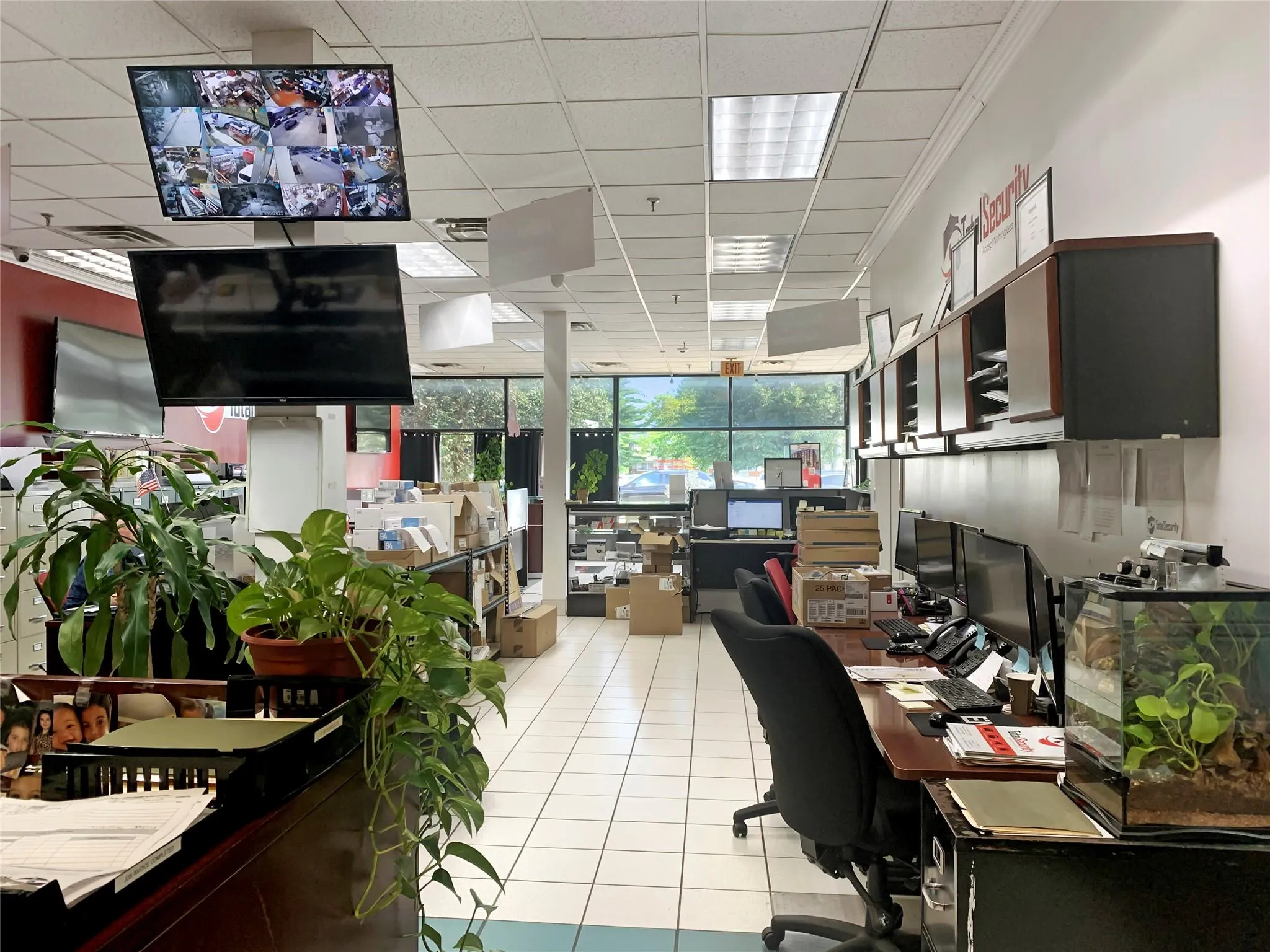 Office featuring a drop ceiling, light tile patterned flooring, and ornamental molding Office featuring a drop ceiling, light tile patterned flooring, and ornamental molding