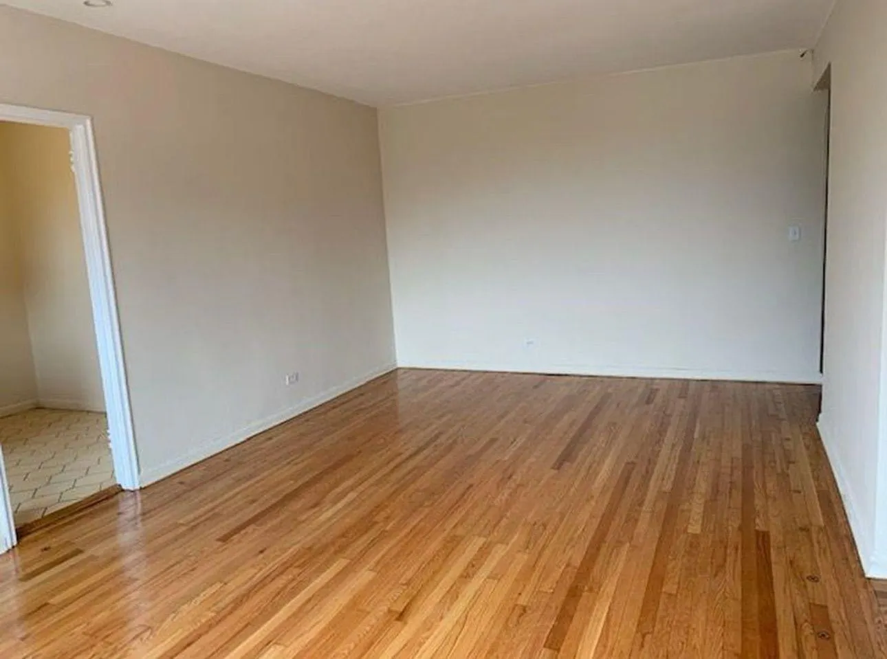 Empty room featuring light wood-style flooring and baseboards Empty room featuring light wood-style flooring and baseboards