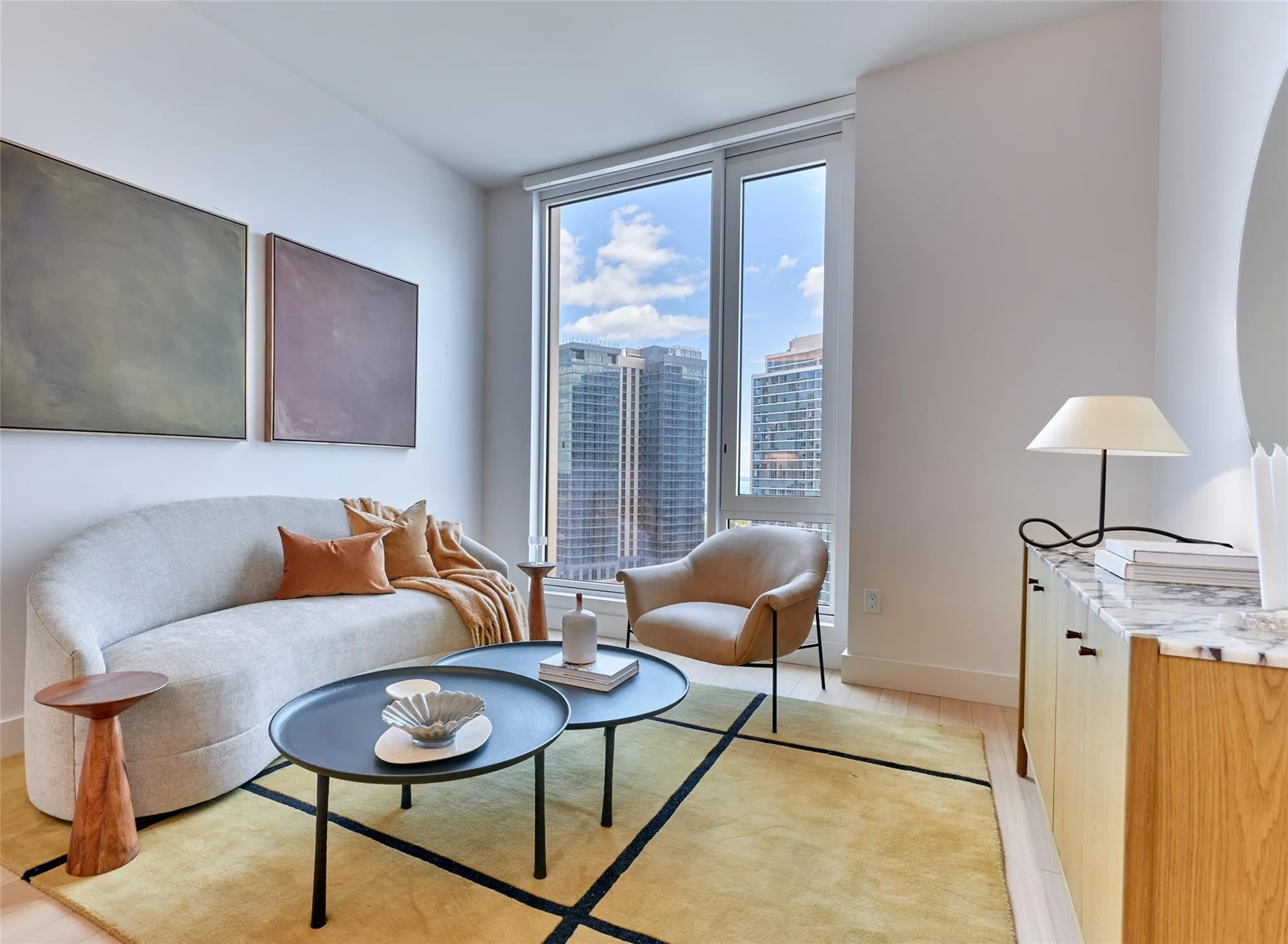 Living area with light wood-type flooring and a city view Living area with light wood-type flooring and a city view