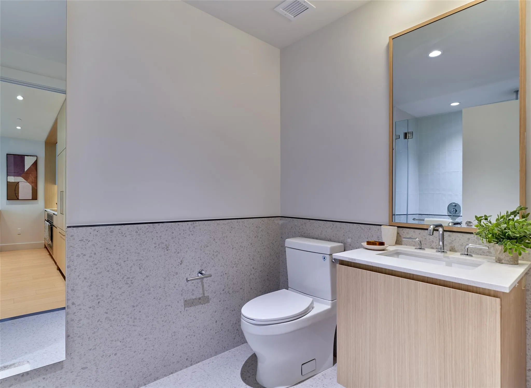 Full bathroom with vanity, a wainscoted wall, recessed lighting, and tile walls Full bathroom with vanity, a wainscoted wall, recessed lighting, and tile walls