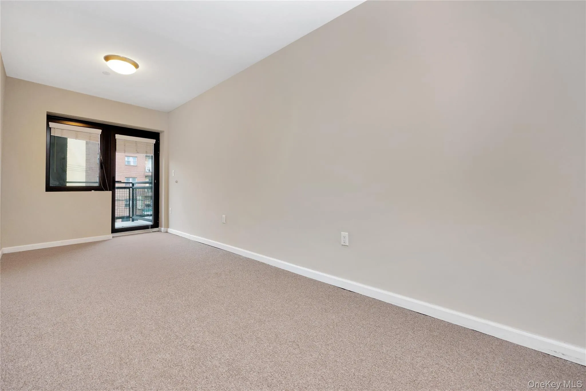 Spare room with baseboards and carpet Spare room with baseboards and carpet