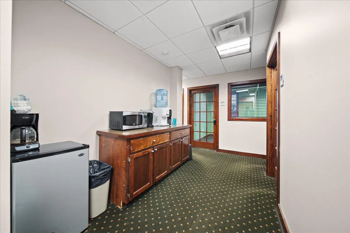 Carpeted office with a paneled ceiling Carpeted office with a paneled ceiling