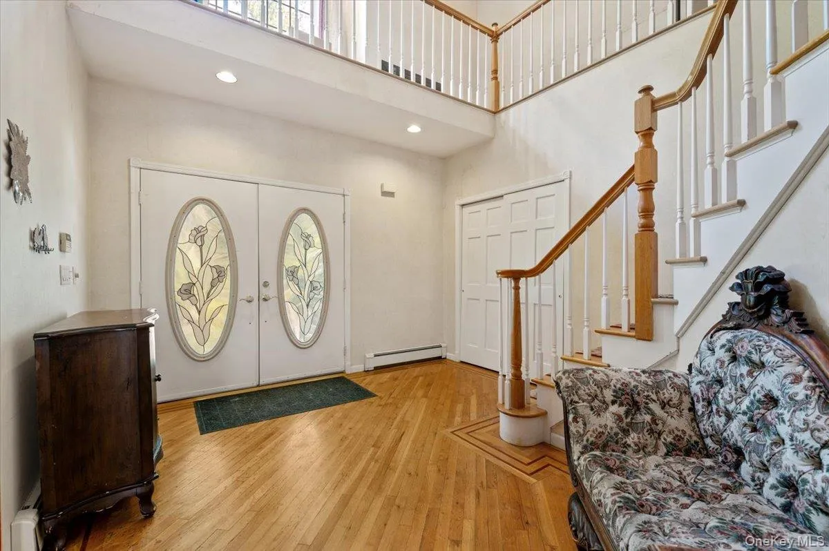Entry Foyer With High Ceiling, French Doors and H/W Floors Entry Foyer With High Ceiling, French Doors and H/W Floors