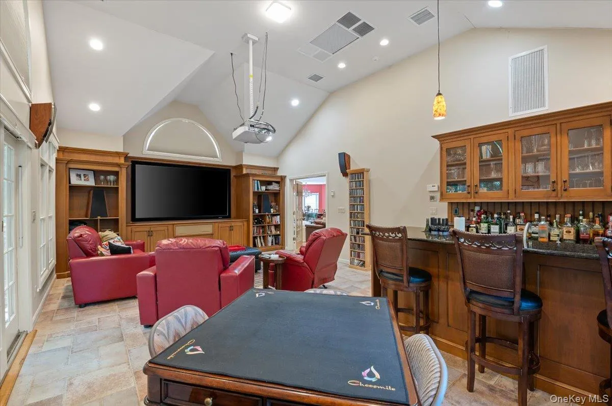 Home Theater, Bar & Game Room With High Vaulted Ceiling, And Sliders Out To The Yard. Home Theater, Bar & Game Room With High Vaulted Ceiling, And Sliders Out To The Yard.