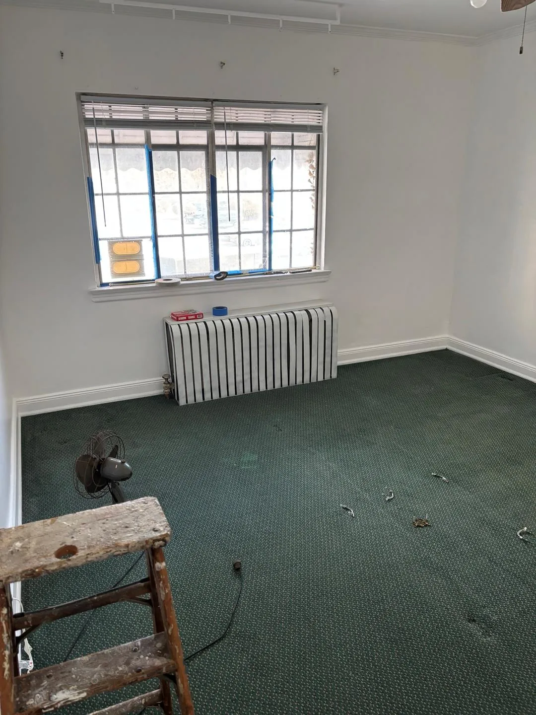 Spare room with carpet floors and radiator Spare room with carpet floors and radiator