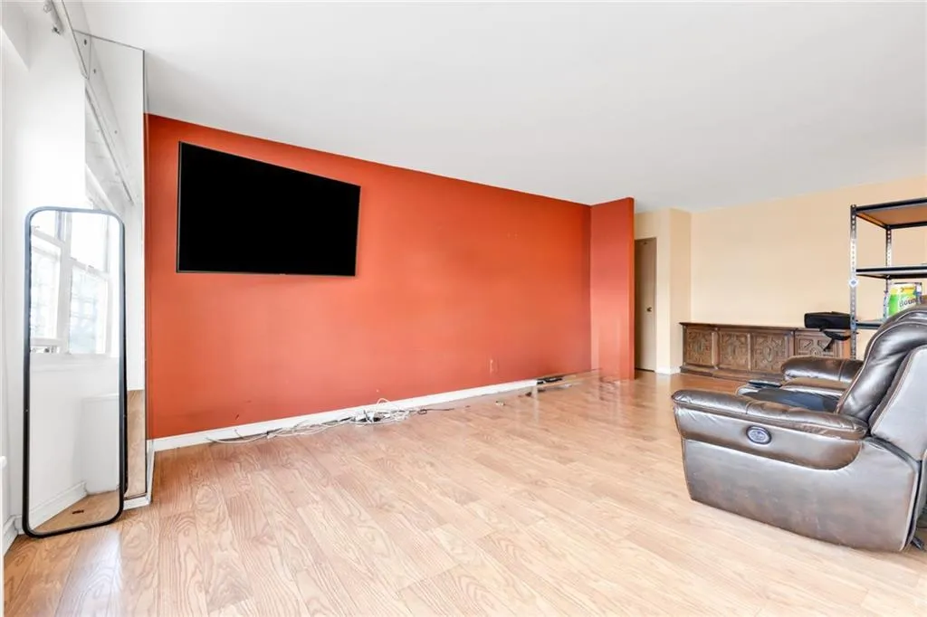 Living room with wood finished floors and baseboards Living room with wood finished floors and baseboards