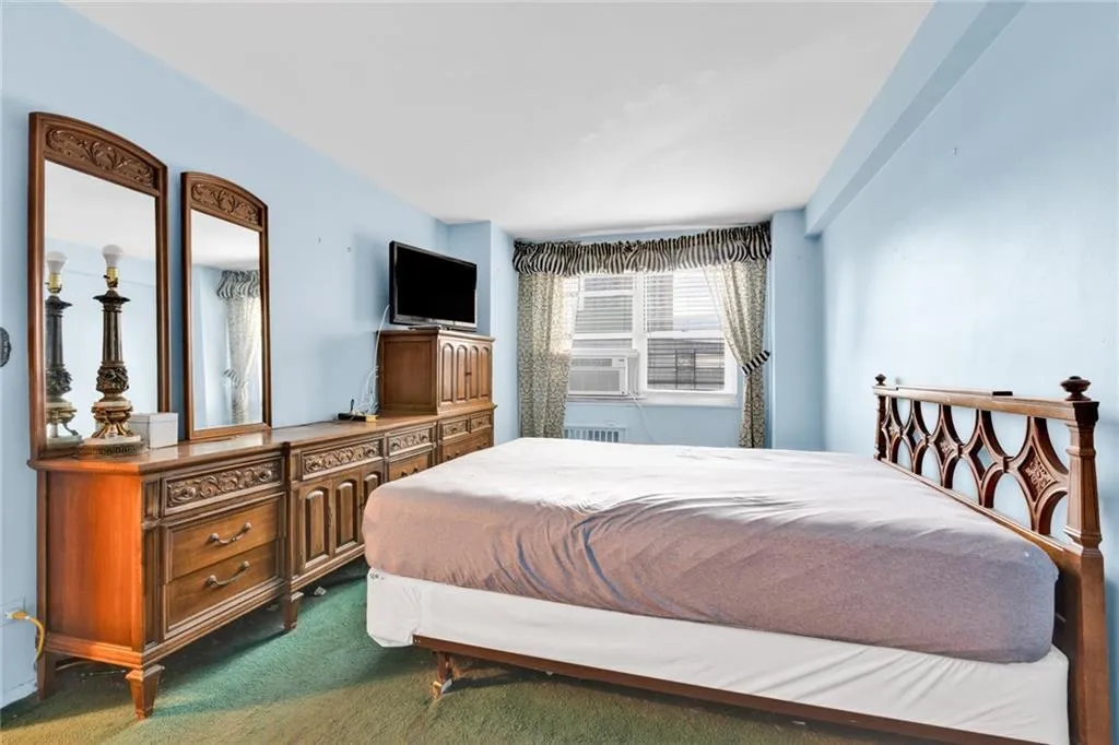 Bedroom featuring dark carpet Bedroom featuring dark carpet