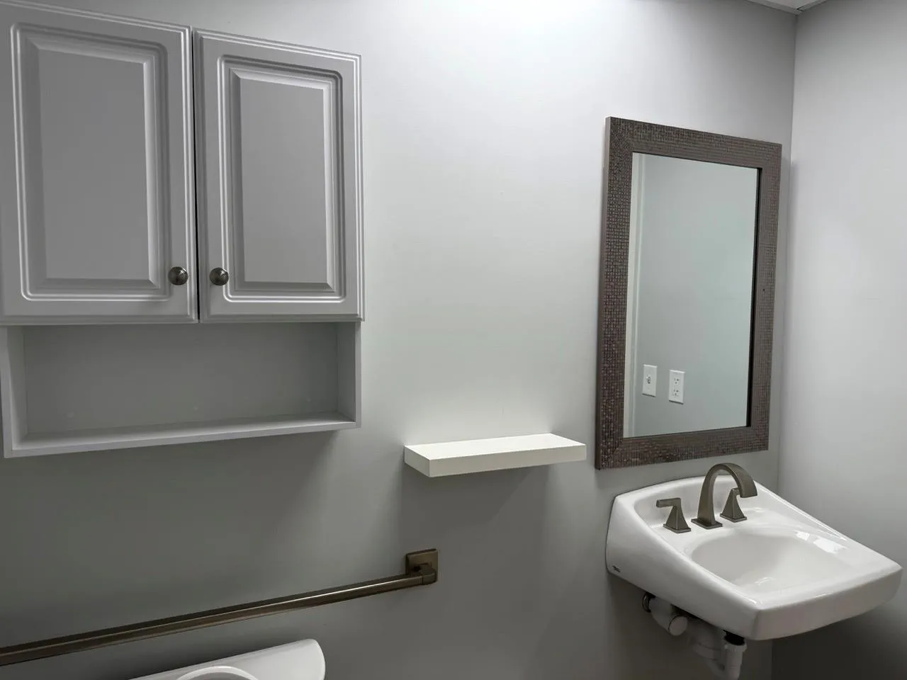 Half bath featuring a sink and toilet Half bath featuring a sink and toilet