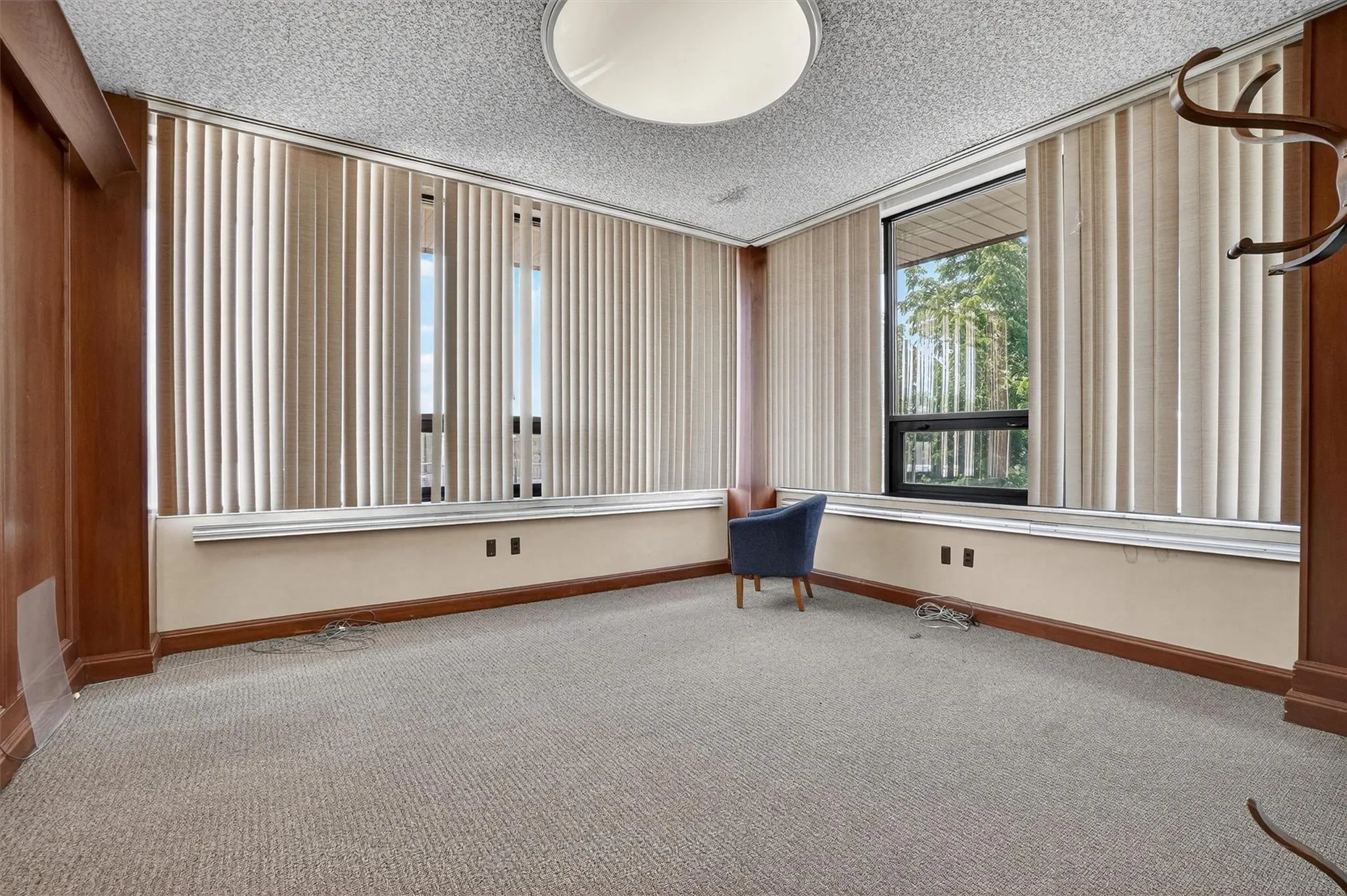 Spare room with carpet and a textured ceiling Spare room with carpet and a textured ceiling