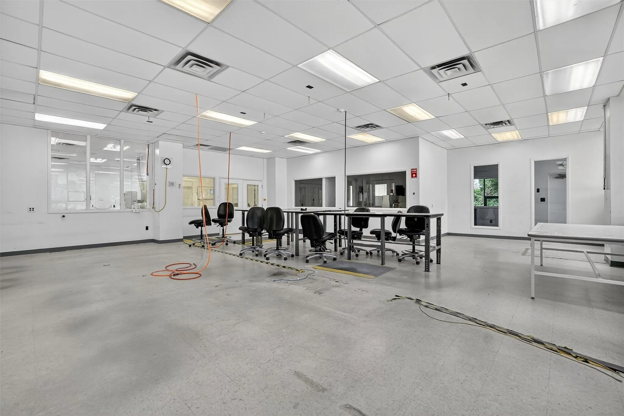 Misc room featuring baseboards and a paneled ceiling Misc room featuring baseboards and a paneled ceiling