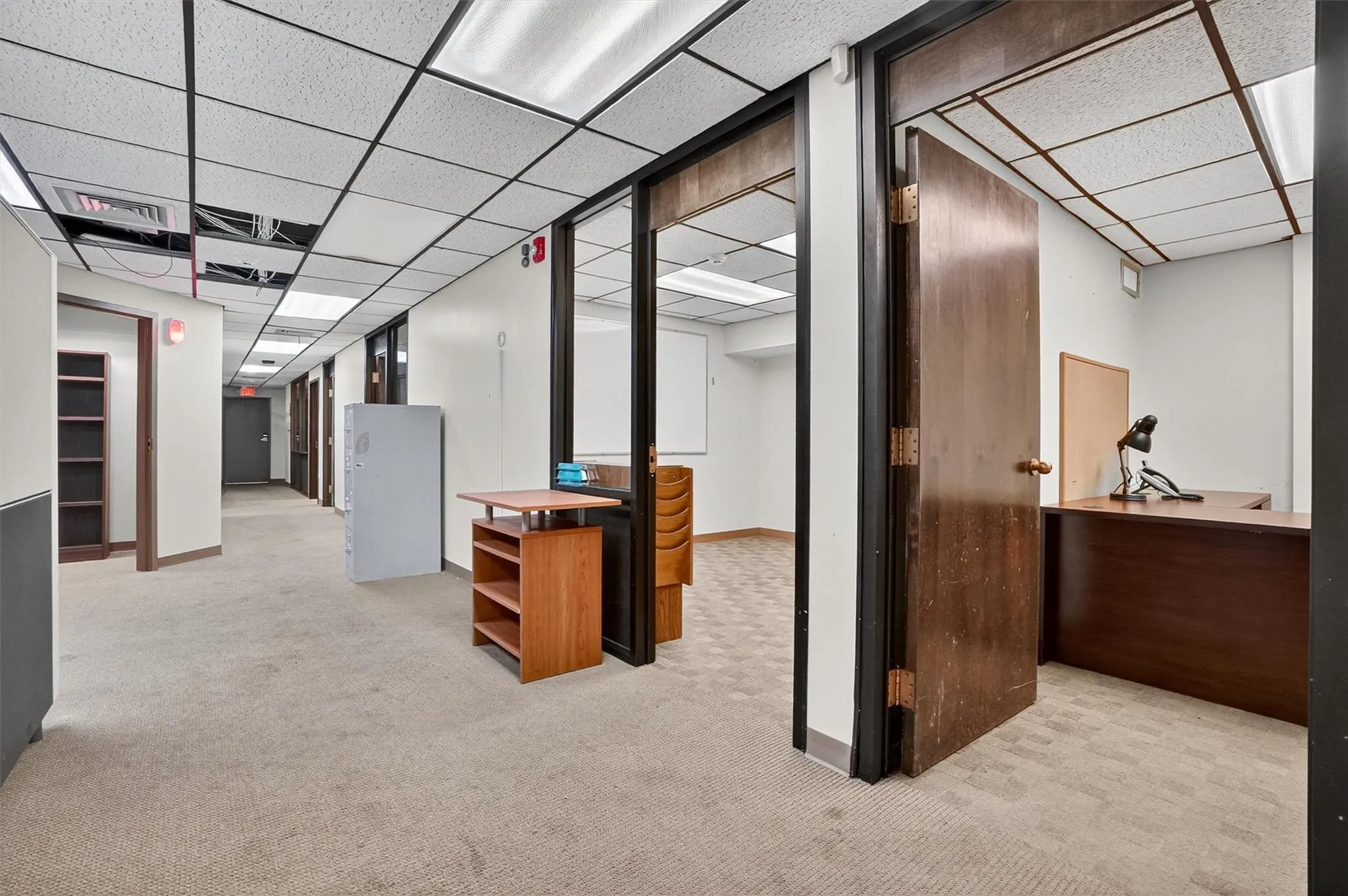 Finished below grade area with a drop ceiling and carpet Finished below grade area with a drop ceiling and carpet