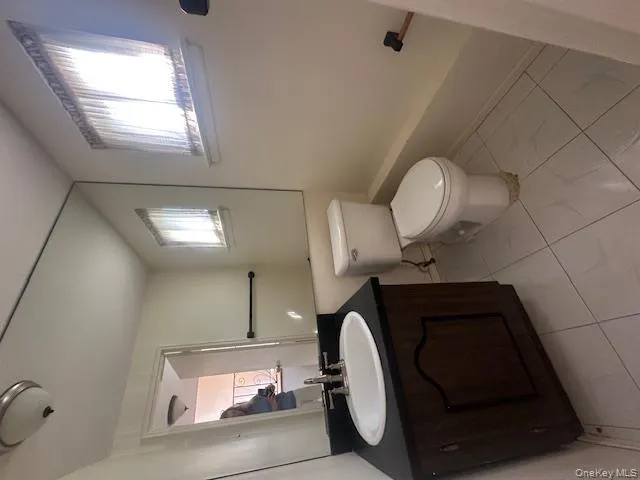 Full bath featuring vanity and a tub Full bath featuring vanity and a tub