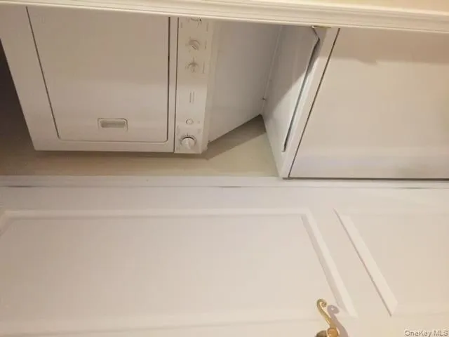 Washroom with stacked washer / dryer Washroom with stacked washer / dryer