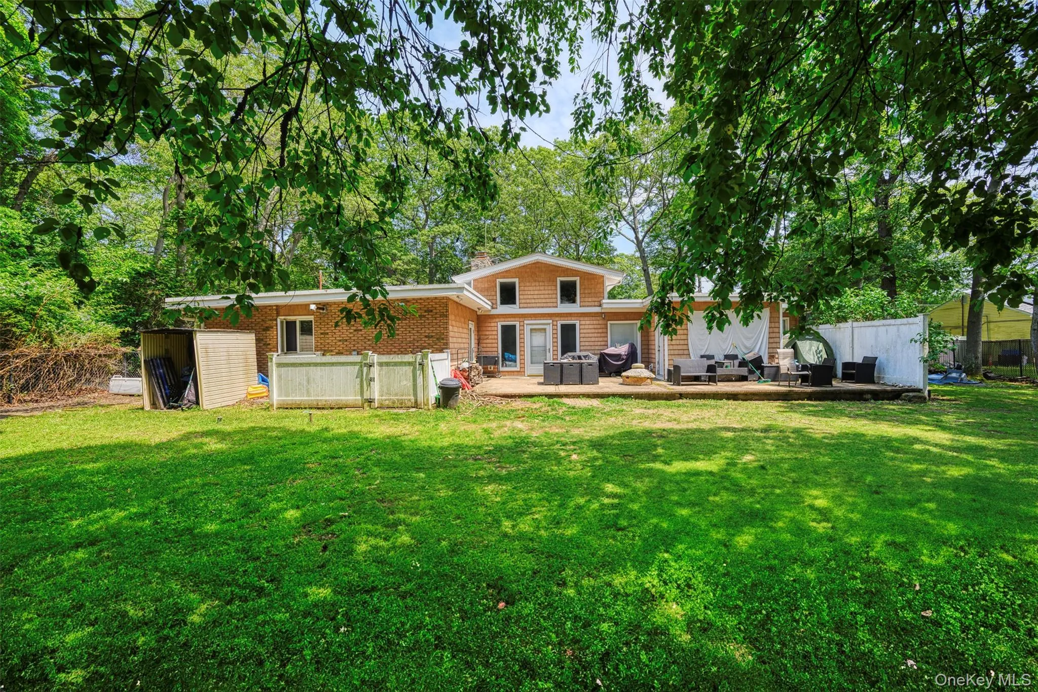 Rear view of house with a storage shed Rear view of house with a storage shed