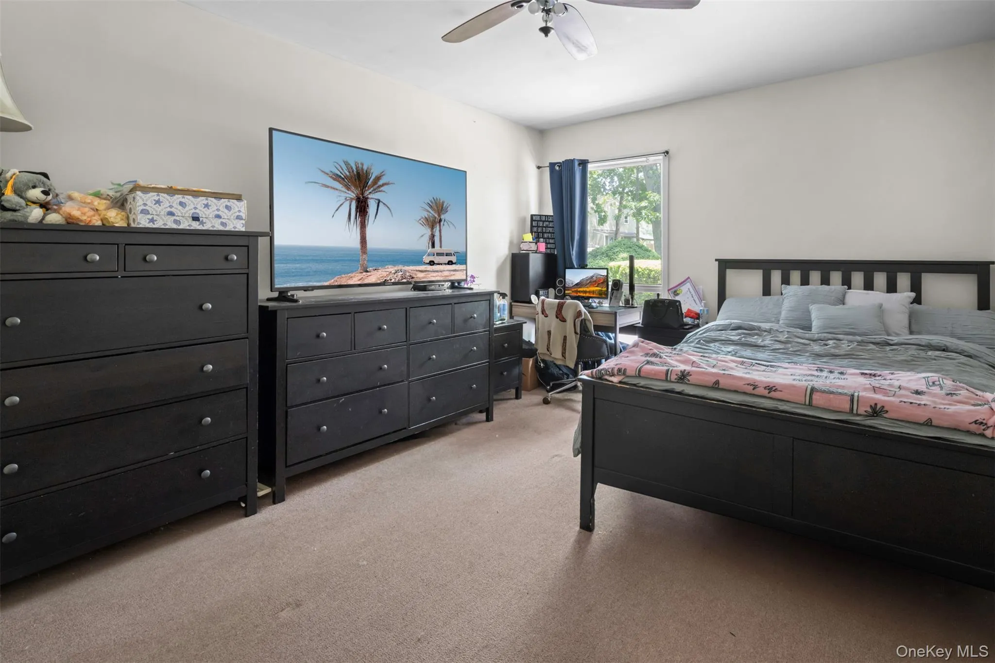 Bedroom with light colored carpet and ceiling fan Bedroom with light colored carpet and ceiling fan