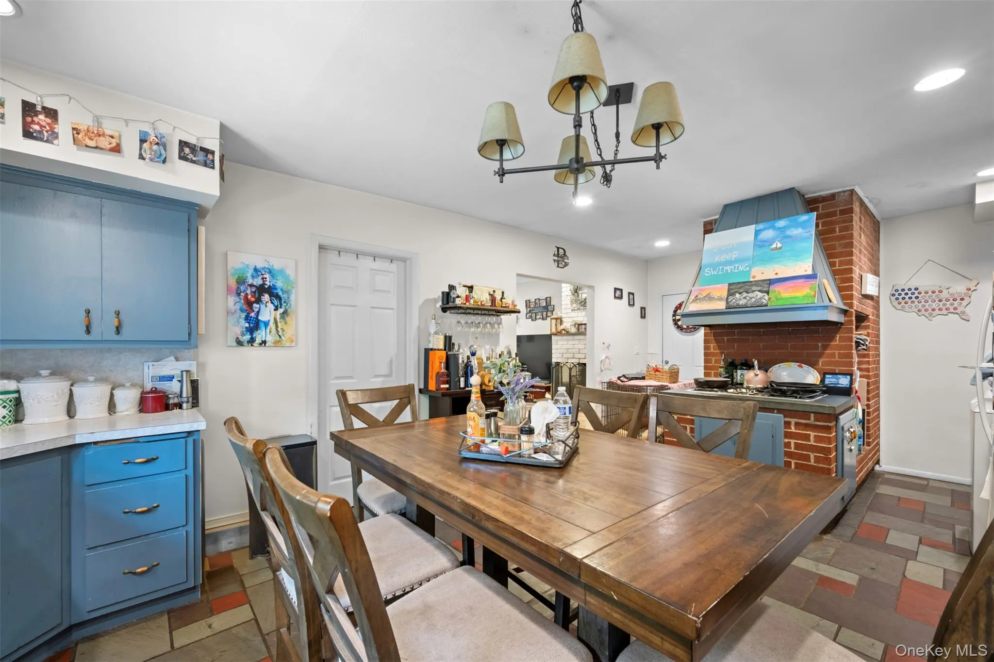 Dining room featuring recessed lighting and a chandelier Dining room featuring recessed lighting and a chandelier