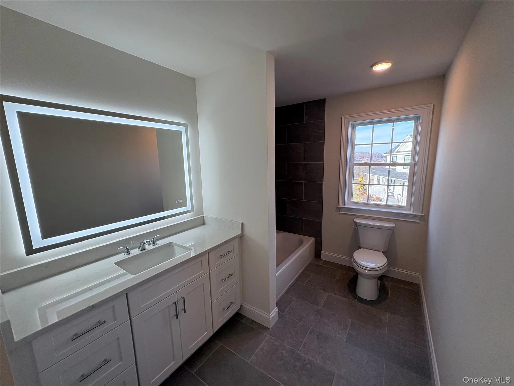 Full bath featuring vanity and shower / bath combination Full bath featuring vanity and shower / bath combination