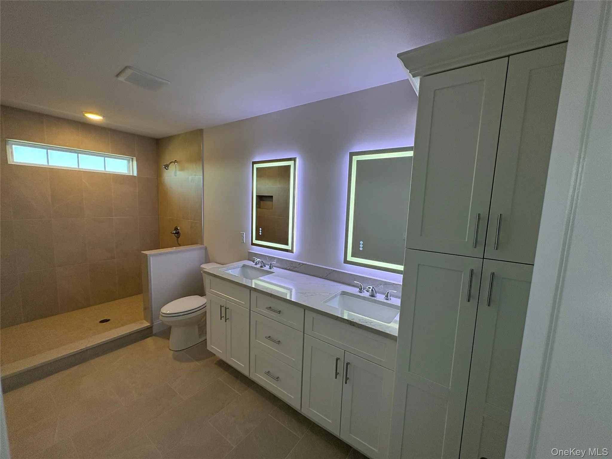 Full bath featuring double vanity and walk in shower Full bath featuring double vanity and walk in shower