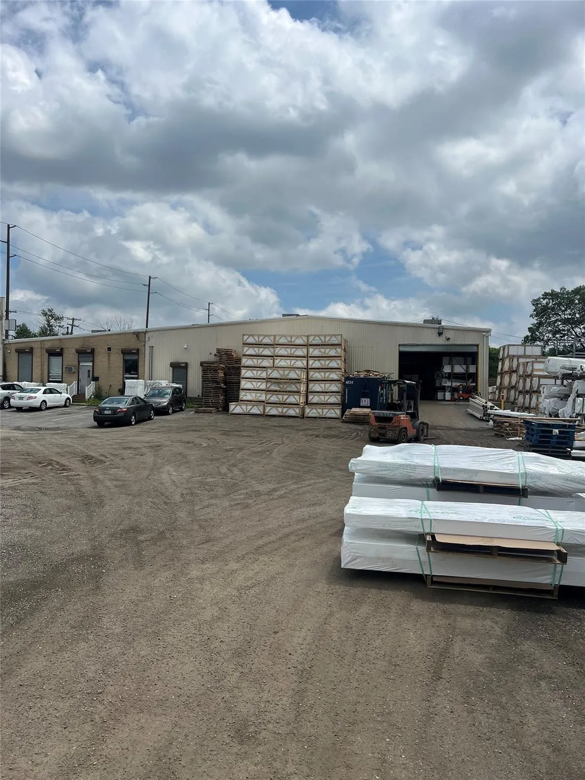 View of parking featuring a pole building View of parking featuring a pole building