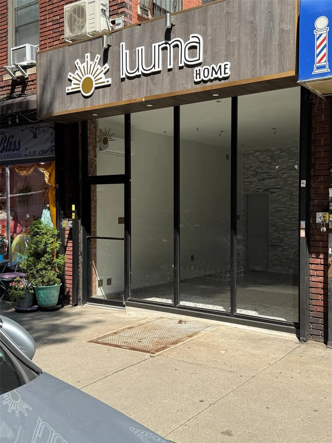 Doorway to property with brick siding and cooling unit Doorway to property with brick siding and cooling unit