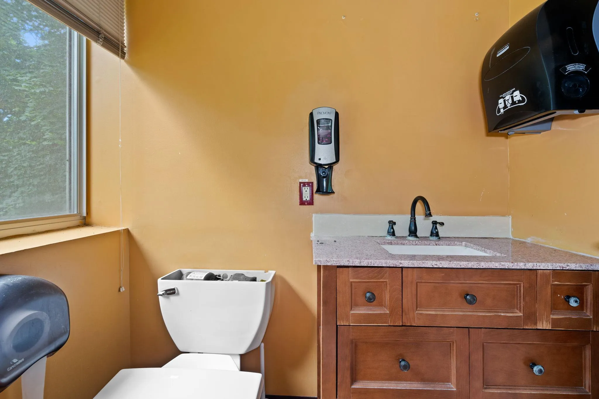 Half bath with toilet and vanity Half bath with toilet and vanity