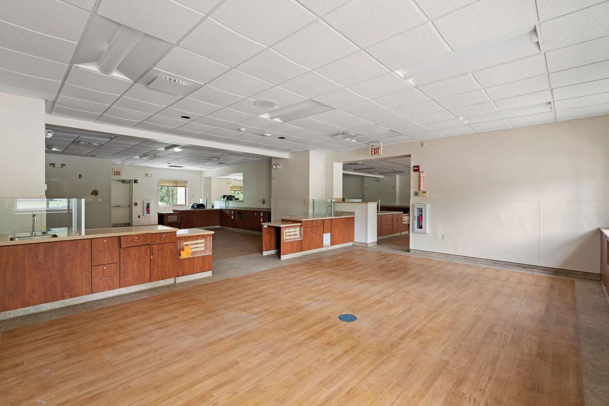 Miscellaneous room with light wood-style floors and a paneled ceiling Miscellaneous room with light wood-style floors and a paneled ceiling