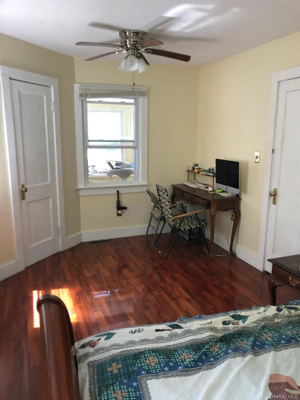 Office featuring a ceiling fan and wood finished floors Office featuring a ceiling fan and wood finished floors