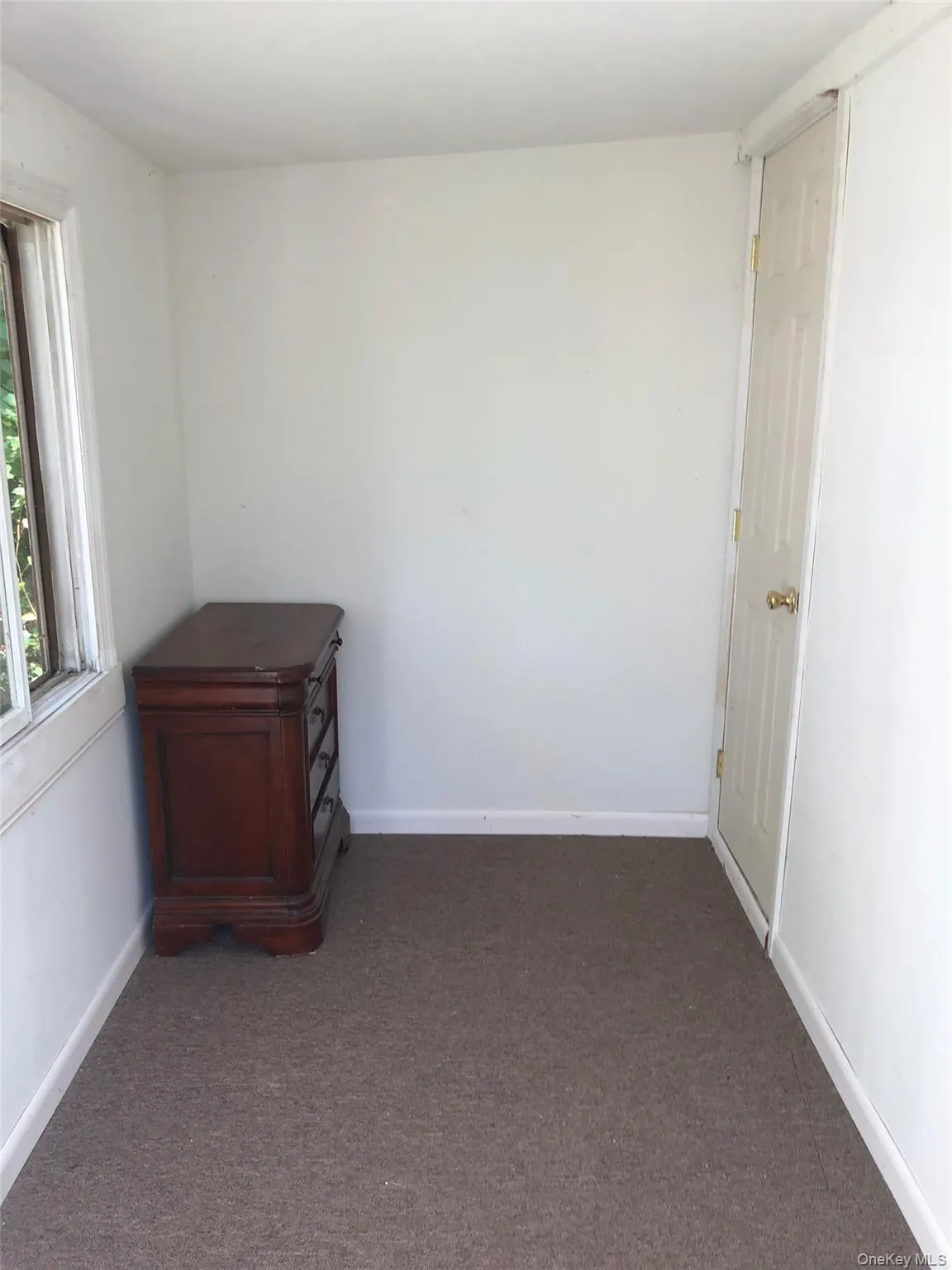Spare room featuring carpet Spare room featuring carpet