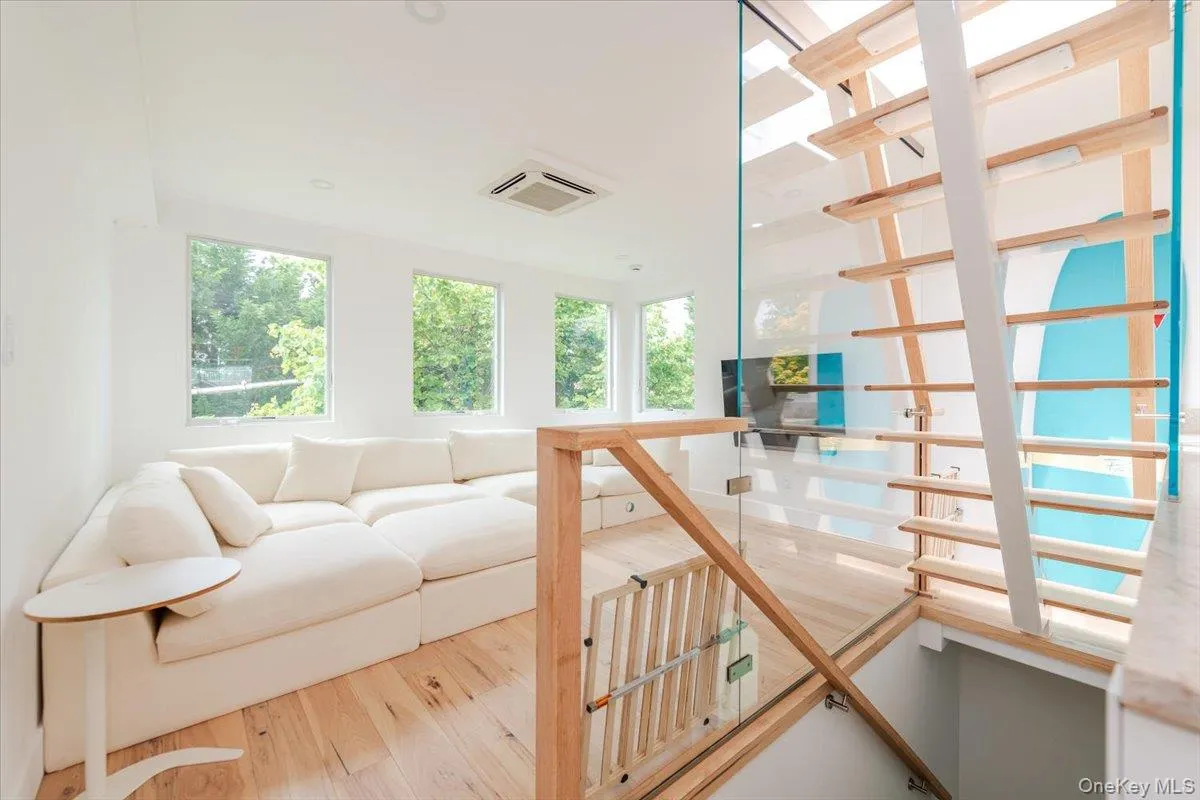 Living area with wood finished floors Living area with wood finished floors