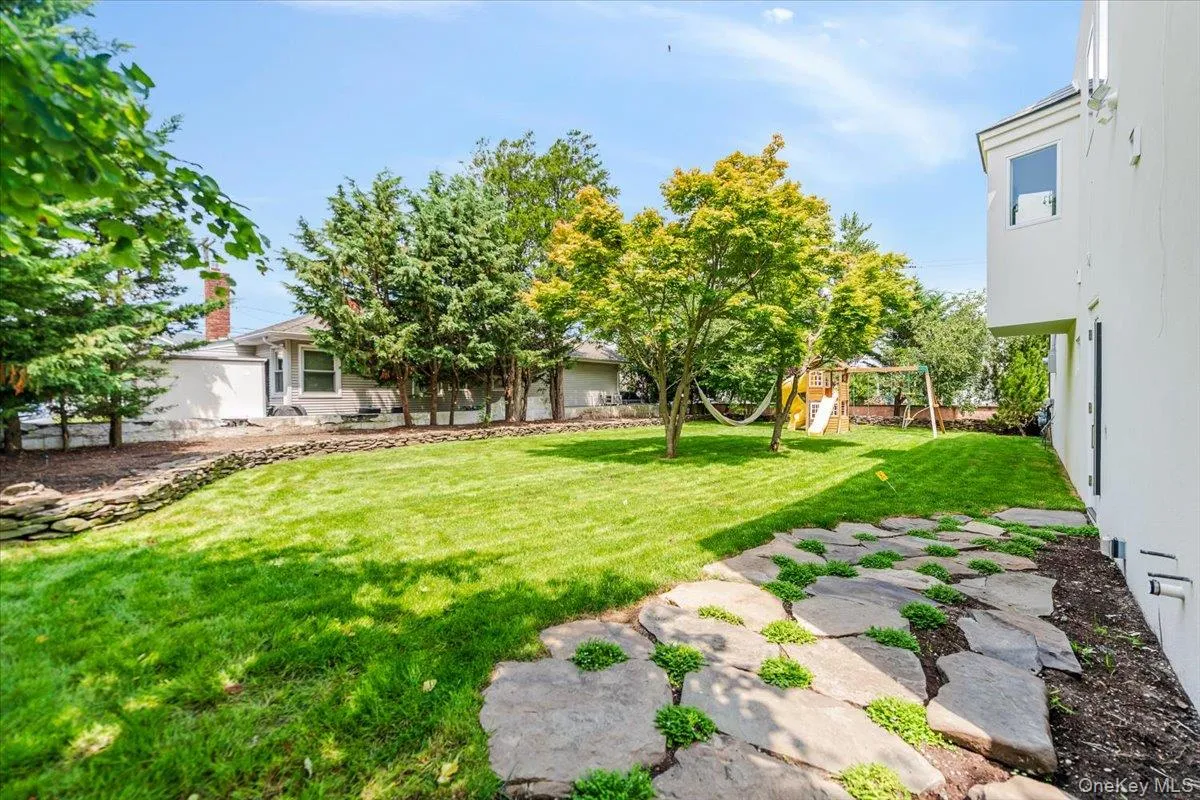 View of grassy yard with a playground View of grassy yard with a playground
