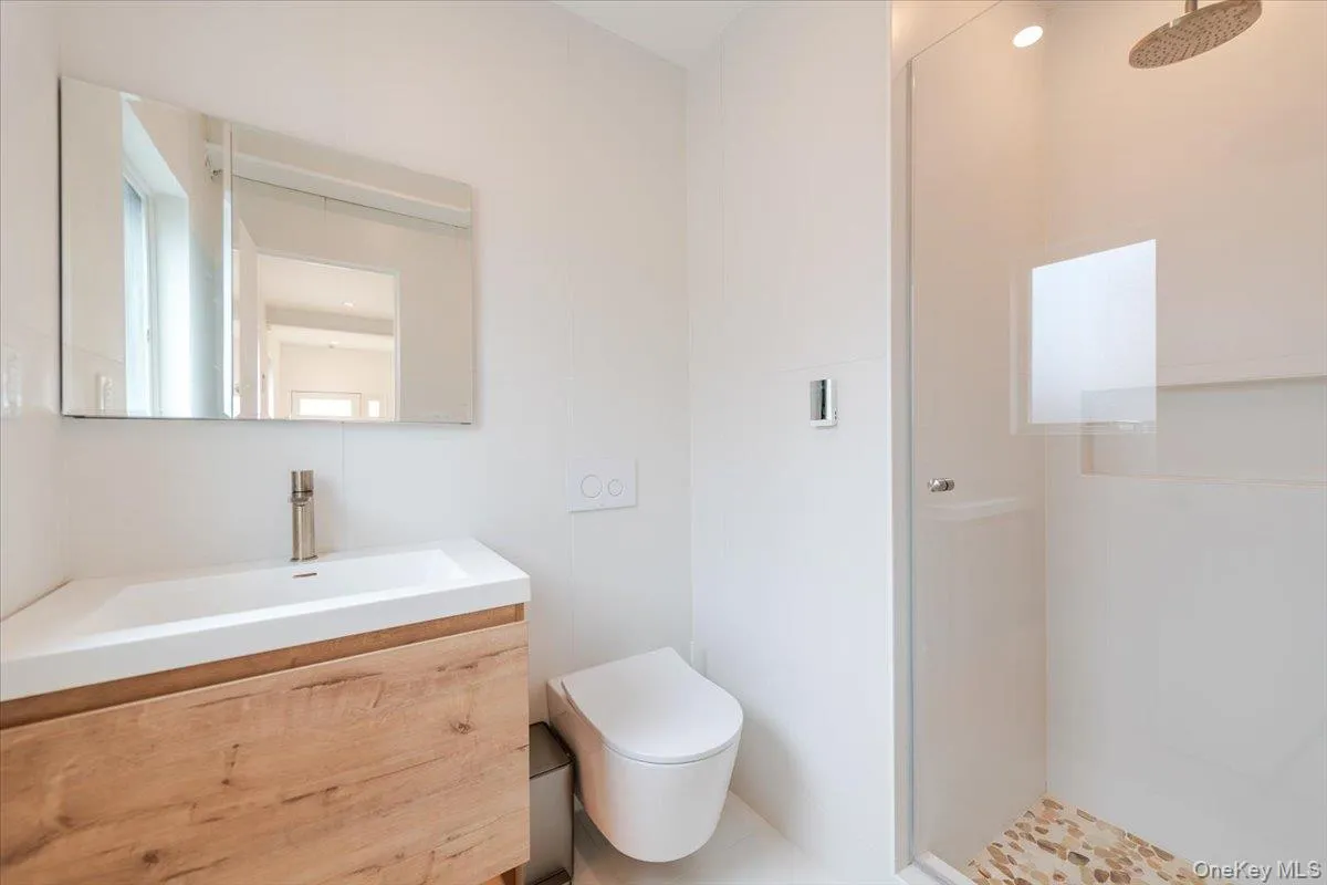 Bathroom with a stall shower and vanity Bathroom with a stall shower and vanity