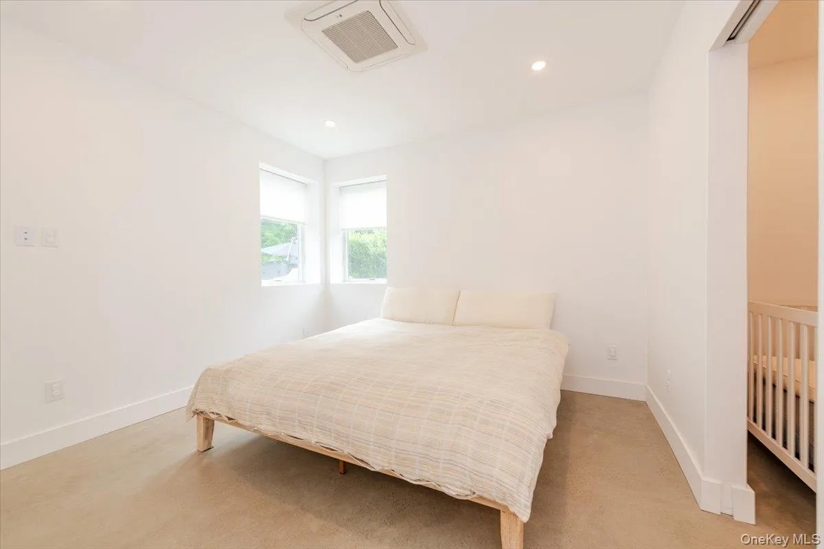 Bedroom with light colored carpet and recessed lighting Bedroom with light colored carpet and recessed lighting