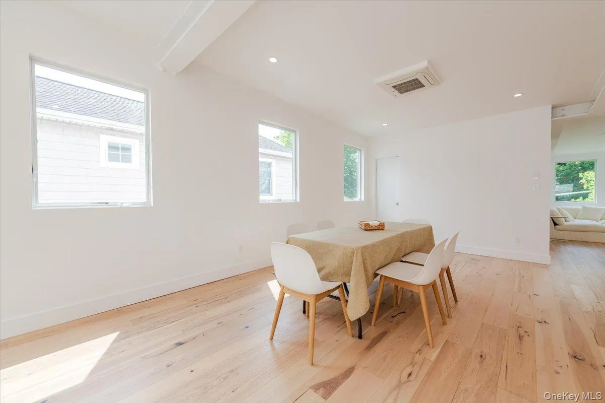 Dining room featuring light wood-style floors and recessed lighting Dining room featuring light wood-style floors and recessed lighting