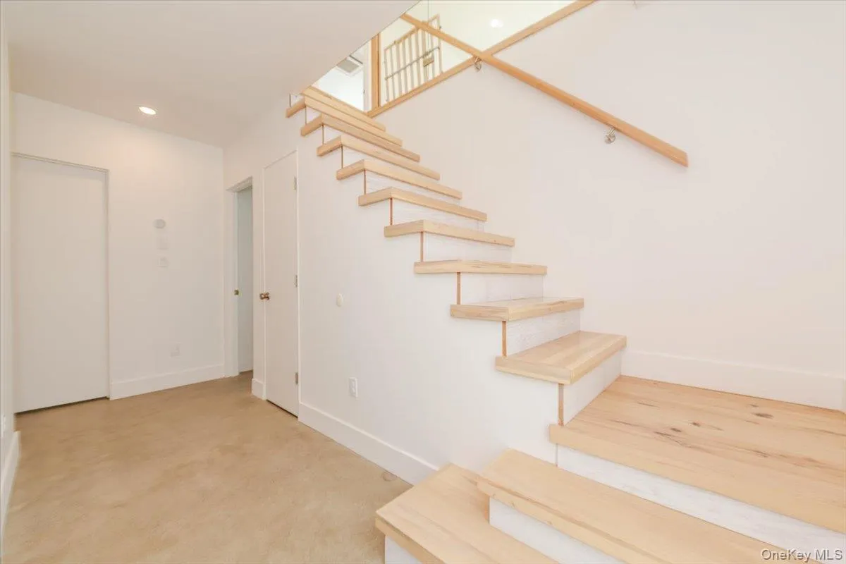 Stairs featuring recessed lighting and carpet floors Stairs featuring recessed lighting and carpet floors