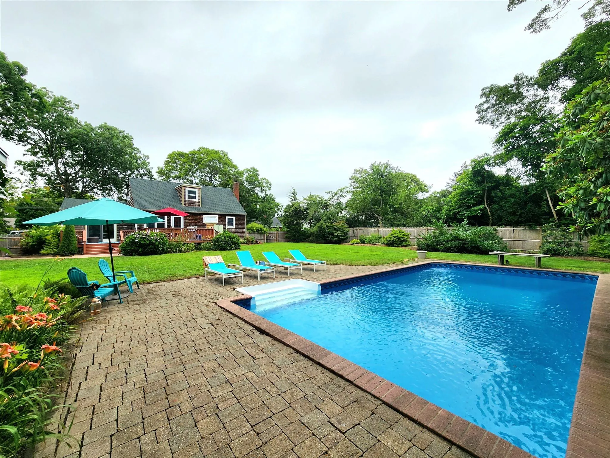 View of pool with a fenced backyard and a patio area View of pool with a fenced backyard and a patio area