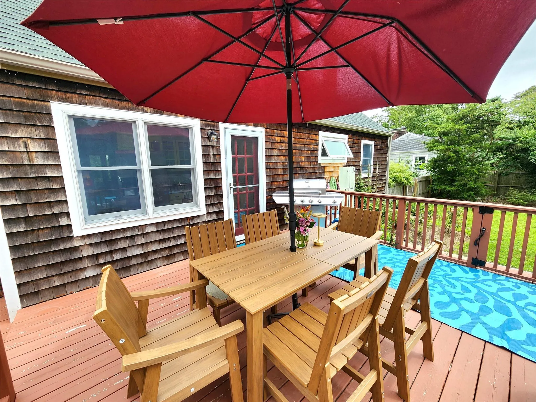 Deck featuring outdoor dining space and a grill Deck featuring outdoor dining space and a grill
