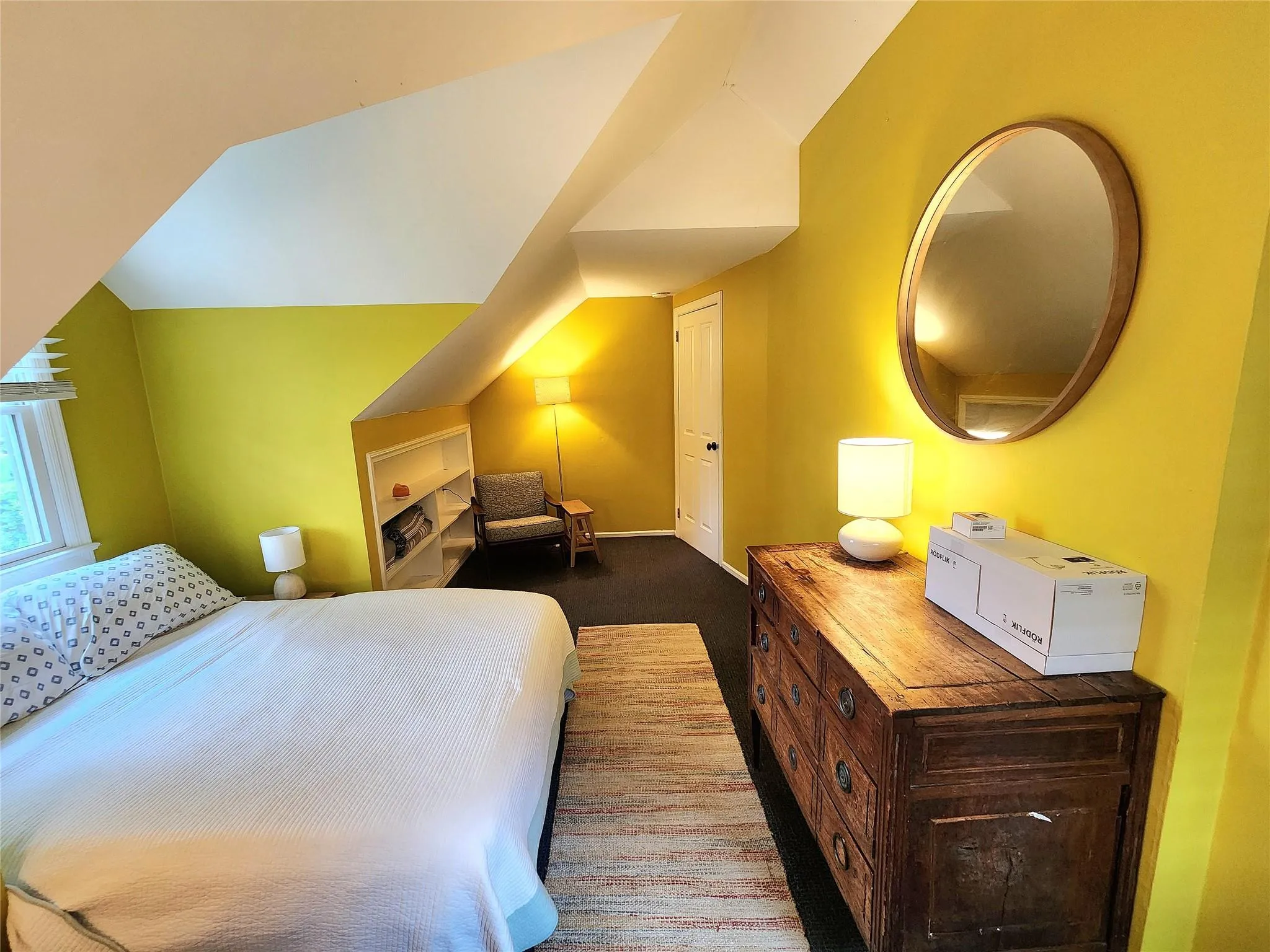 Bedroom with lofted ceiling and carpet Bedroom with lofted ceiling and carpet