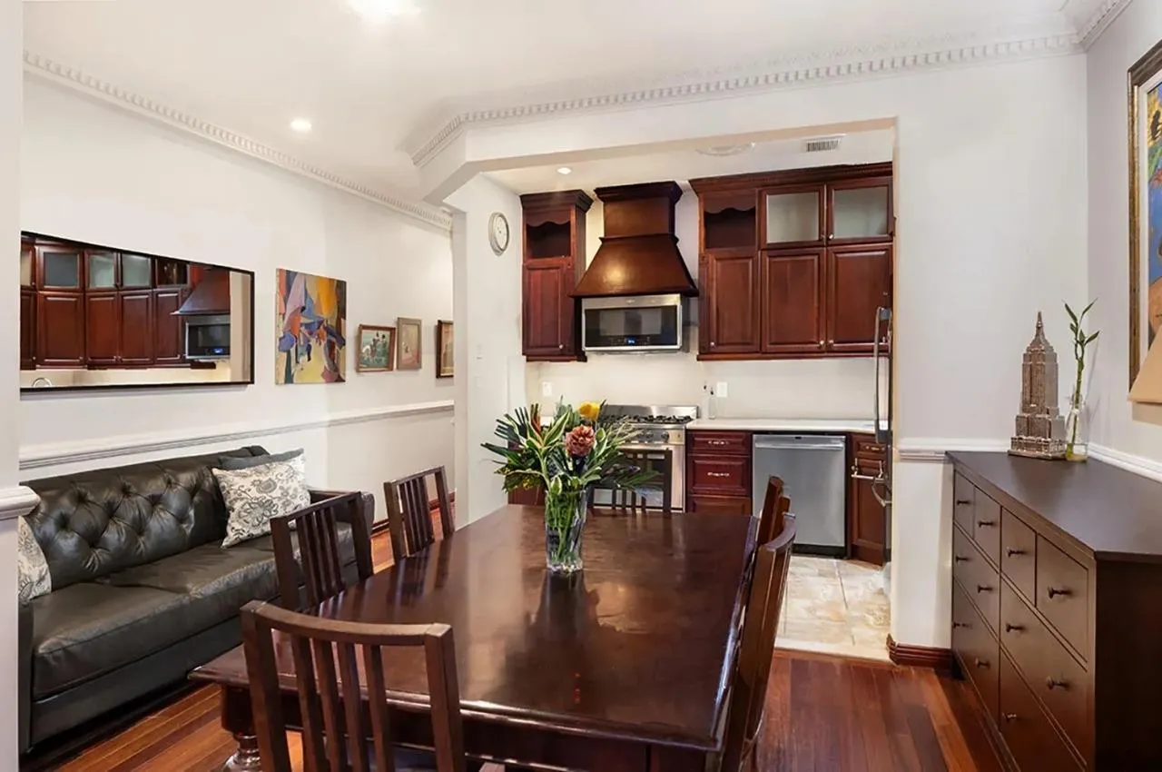 Dining space featuring dark wood finished floors, crown molding, and recessed lighting Dining space featuring dark wood finished floors, crown molding, and recessed lighting
