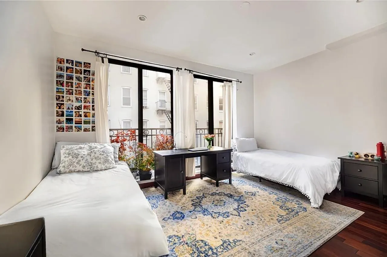 Bedroom featuring wood finished floors Bedroom featuring wood finished floors